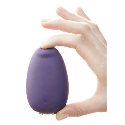 Je Joue Mimi Clitoris Vibrator Being Held In Hand and Squeezed