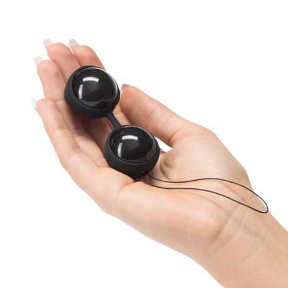 Lelo Luna Beads Noir Pelvic Exerciser Being Held In Palm Of Hand