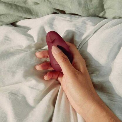 Dame Pom Clitoral Vibrator Held In Hand