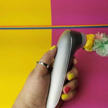 Satisfyer Luxury High Fashion Clitoral Stimulator Held In Hand
