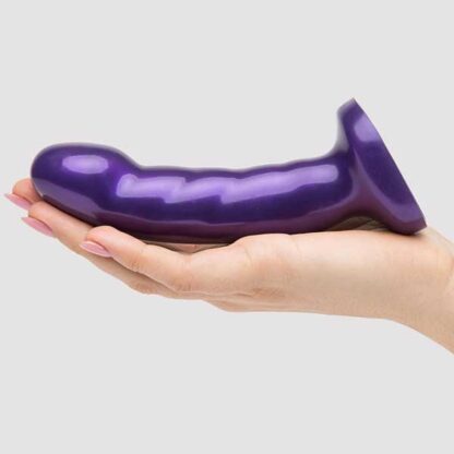 Tantus Acute Midnight Dildo Held In Palm of Hand