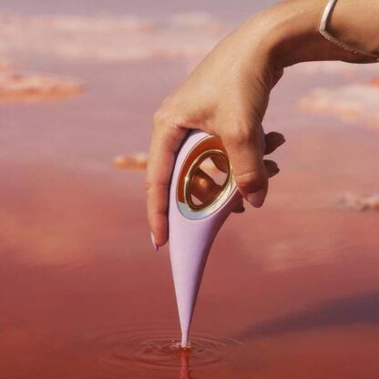 Lelo Dot Clitoral Vibrator Held In Hand