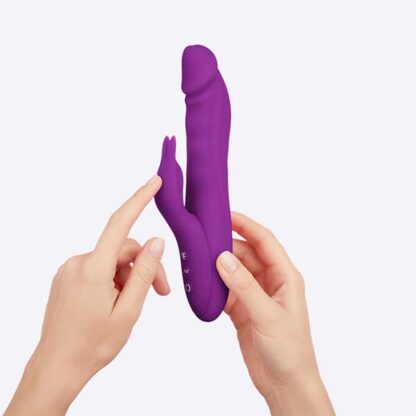 FemmeFunn Booster Rabbit Vibrator Held In Hand