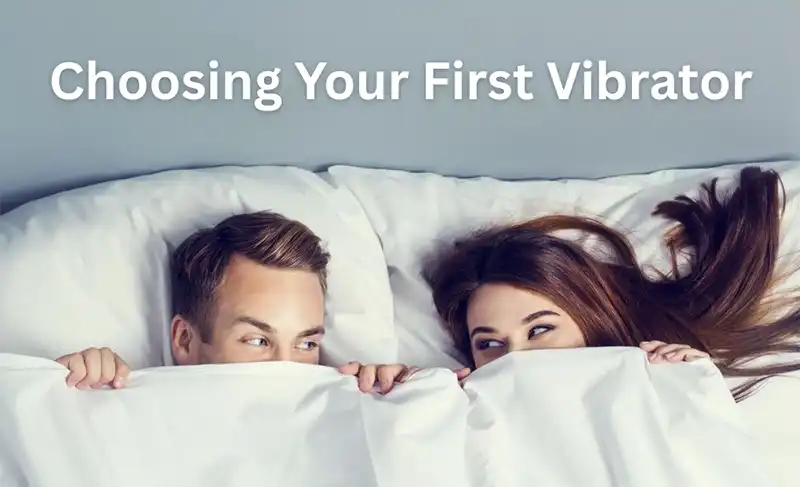 Get help buying a vibrator for the first time from a Christian perspective. This is a picture of a couple in bed with the sheets pulled up to their noses.